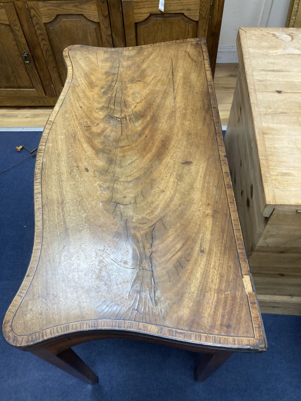 A George III mahogany and satinwood serpentine card table, width 88cm depth 44cm height 76cm